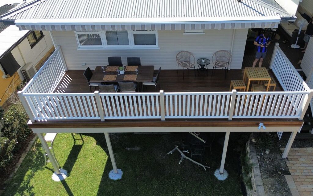 Completed elevated timber deck with white balustrade, seen from above