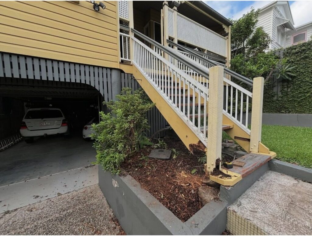 External timber stairs being measured up on a Brisbane Queenslander