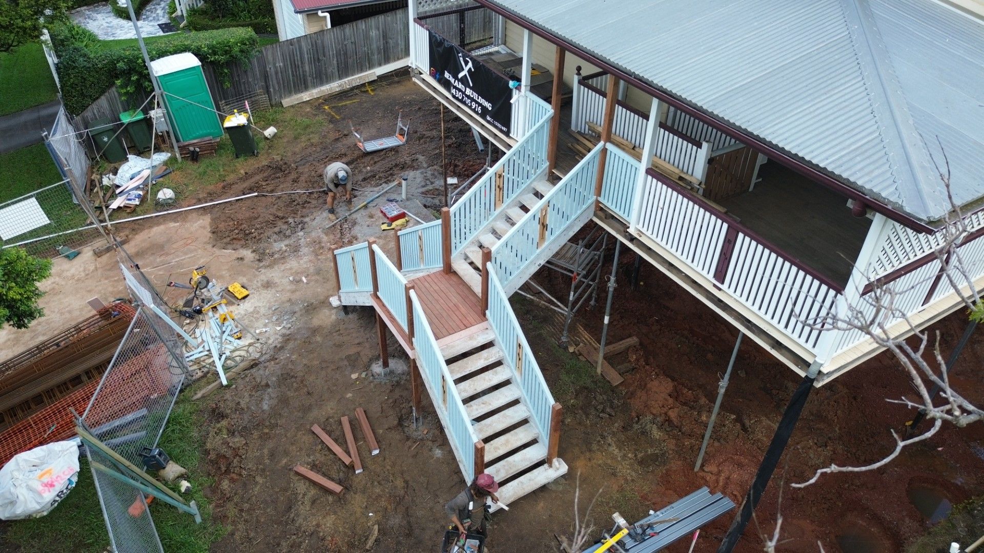 Drone view of new external stairs and landings mid-build on a raised Brisbane Queenslander